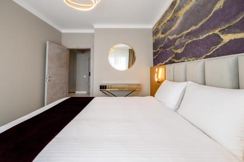 Voodi või voodid majutusasutuse Elitte Inn & Suites toas