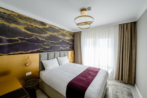 Voodi või voodid majutusasutuse Elitte Inn & Suites toas