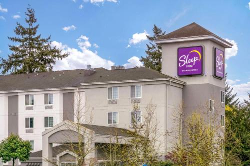 a building with a sign on the side of it at Sleep Inn Sea Tac Airport in SeaTac