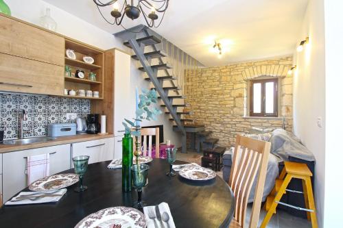 a kitchen and dining room with a table and chairs at Apartment 2323 in Foli