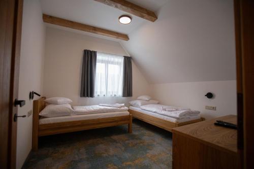 Postel nebo postele na pokoji v ubytování Apartmány Lúčny Raj