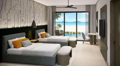 Miches的住宿－Zemi Miches All-Inclusive Resort, Curio Collection By Hilton，酒店客房设有两张床,享有海景。