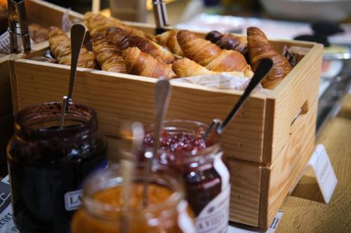a crate of pastries and a basket of bread at Ibis Budget Bilbao City in Bilbao