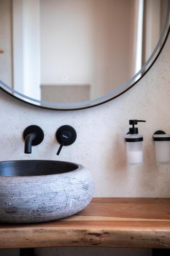a bathroom with a sink and a mirror at Elysian Fields in Mġarr