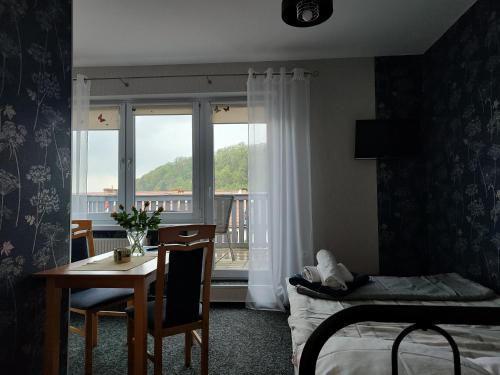 Posteľ alebo postele v izbe v ubytovaní Apartamenty Hejszowina
