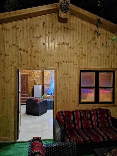 a room with a couch and a living room at Yaso Roof & Apartments in Amman