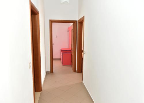 an empty corridor with two doors and a room at Vila Merkuri in Vlorë