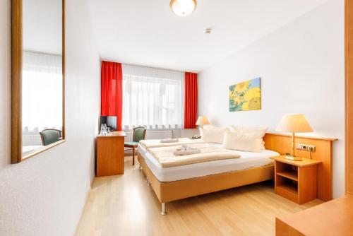 Postel nebo postele na pokoji v ubytování Aktivhotel Alter Kaiser