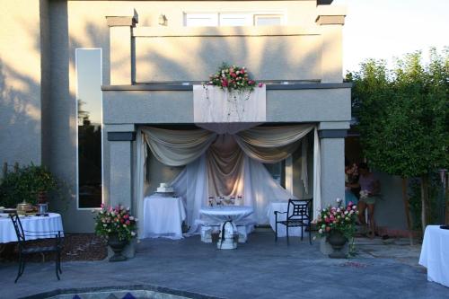 a stage with a table and chairs in a building at Villa Caridad in Las Vegas