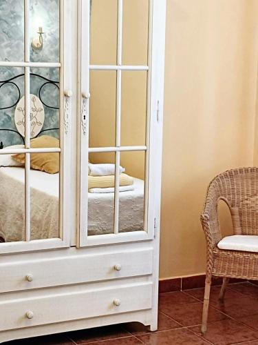 a white cabinet with a mirror in a room at Spacious house in Cenicientos with mountain view in Cenicientos