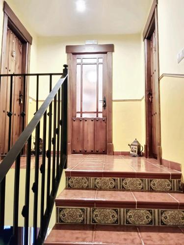 an entrance to a house with a wooden door at Spacious house in Cenicientos with mountain view in Cenicientos