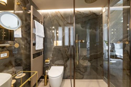 a bathroom with a shower and a toilet at Hotel Palazzina Sardi in Venice