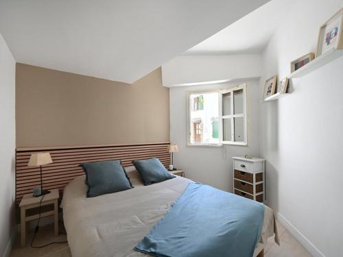 Un pat sau paturi într-o cameră la Maison Les Portes-en-Ré, 3 pièces, 4 personnes - FR-1-434-94