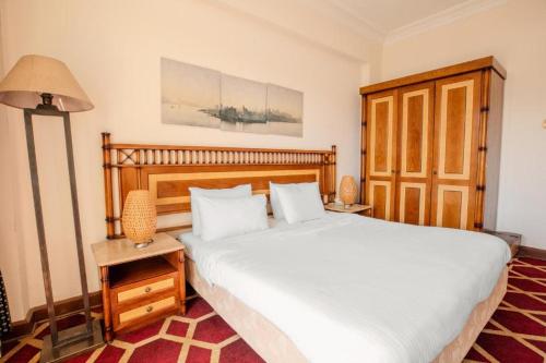 Ένα ή περισσότερα κρεβάτια σε δωμάτιο στο Om Kalthom Hotel