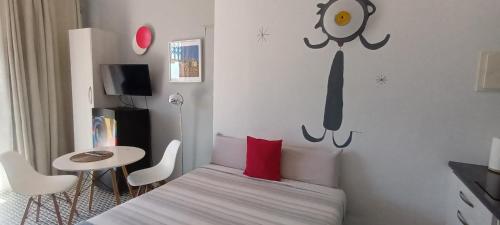 Ένα ή περισσότερα κρεβάτια σε δωμάτιο στο Sunrise Studio Miro, vistas jardín y mar