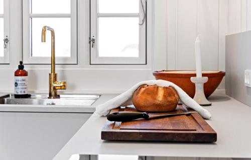 a kitchen counter with a cutting board with a turkey and a knife at 3 Bedroom Lovely Home In Saltum in Saltum