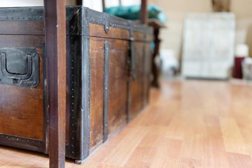 a row of wooden chests on a wooden floor at Antro Di Circe - Orta Centro in Orta San Giulio