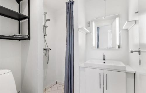 a white bathroom with a sink and a shower at 2 Bedroom Stunning Apartment In Gilleleje in Gilleleje