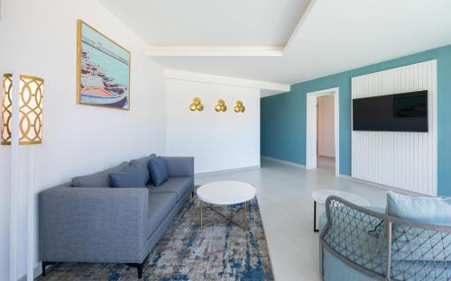 a living room with a couch and a table at Hilton Skanes Monastir Beach Resort in Monastir