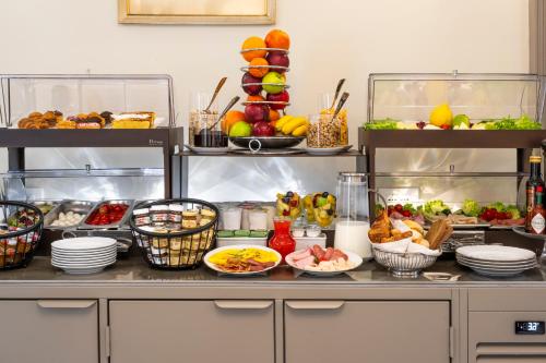 a buffet with many different types of food on it at Hotel Palazzina Sardi in Venice