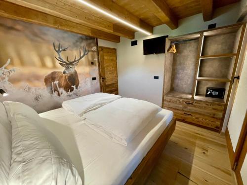 Een bed of bedden in een kamer bij Ewotions Lodge
