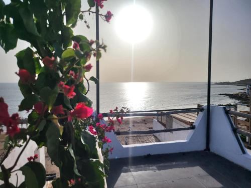 a view of the ocean from the balcony of a boat at Vanila Taghazout in Taghazout