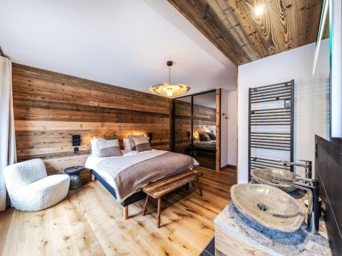 Giường trong phòng chung tại Luxueux appartement 5 chambres avec jacuzzi et Wi-Fi aux Gets - FR-1-671-250