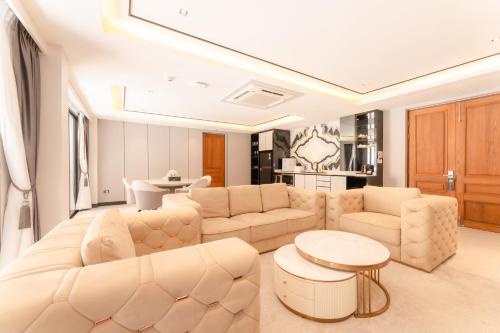 a living room with a couch and a table at Verbena Chiangmai in Chiang Mai