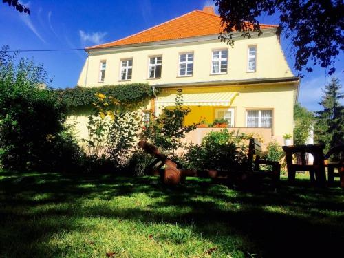 a large white house with an orange roof at 1 Schwerin in Borkow