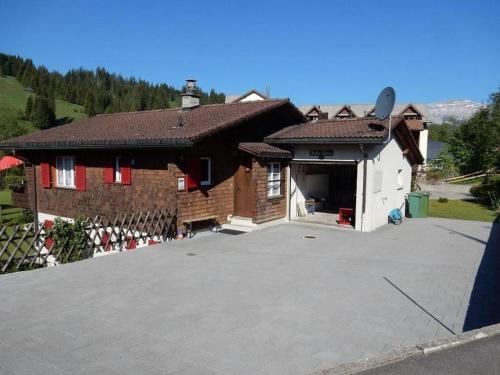 a house with a large parking lot in front of it at Bella Vista - b48836 in Sörenberg