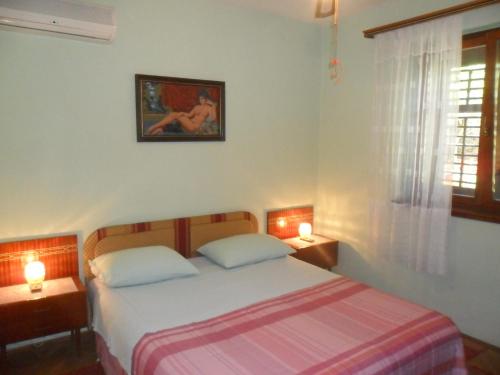 Postel nebo postele na pokoji v ubytování Apartmani Yucca
