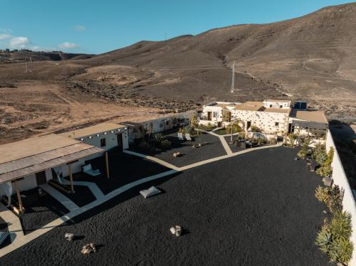an aerial view of a building in the desert at Finca Luz in Puerto del Rosario