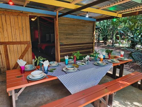 a table with plates of food on top at Shangrila-innibos Country Lodge in Hartbeespoort