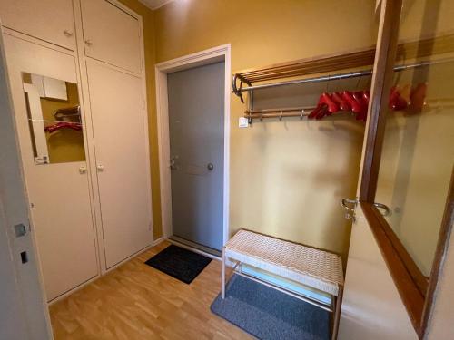a small room with a bunk bed and a closet at The Golden Glow Apartment Turku in Turku