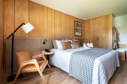 Ένα ή περισσότερα κρεβάτια σε δωμάτιο στο Hotel Alpestre
