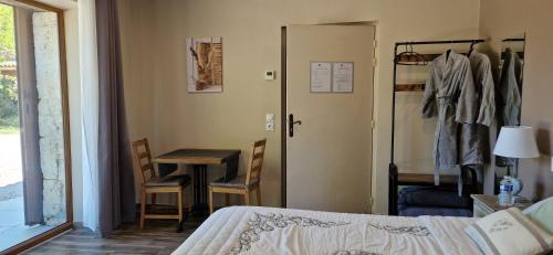 Postel nebo postele na pokoji v ubytování Le Miroir des Etoiles