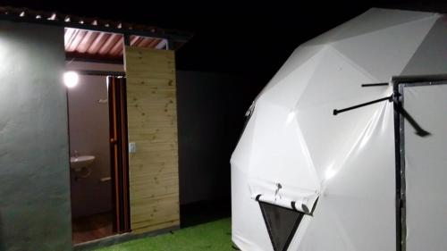 a white tent in a room with a bathroom at GLAMPING DOMO VILLETA in Villeta