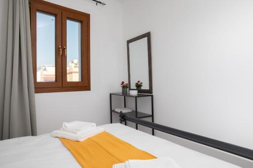 Ein Bett oder Betten in einem Zimmer der Unterkunft Leros Houses a Porto Lago