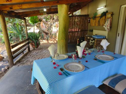 a blue and white table with two sinks on a porch at Shangrila-innibos Country Lodge in Hartbeespoort