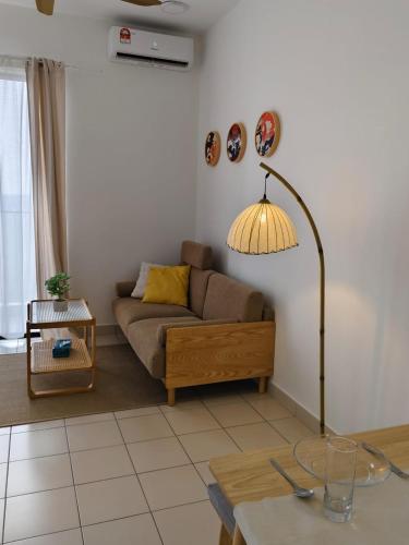 a living room with a couch and a table at MUJI Cosy Level 25th Room Amber Residence @ Quayside Mall Rimbayu Near to Masha Oasis Tenby KLIA Kota Kemuning in Teluk Panglima Garang