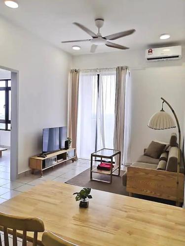 a living room with a couch and a table at MUJI Cosy Level 25th Room Amber Residence @ Quayside Mall Rimbayu Near to Masha Oasis Tenby KLIA Kota Kemuning in Teluk Panglima Garang