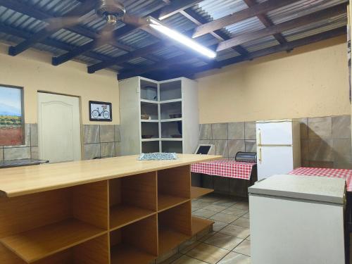 a kitchen with a large counter in a room at Shangrila-innibos Country Lodge in Hartbeespoort