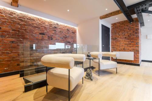 Posezení v ubytování Omnia by The Heim Residences