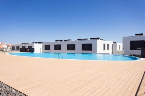 a large swimming pool in front of a building at Sweet home Abades in Abades