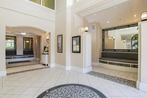 a lobby with a large mirror on the wall at Foxy Palmer Lost Key 205 in Perdido Key