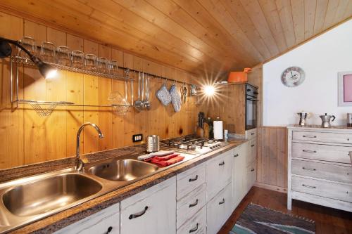 a kitchen with a sink and a stove at Natura e Relax in Sacco