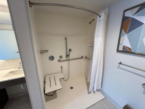 a bathroom with a shower and a sink at Comfort Suites Gatlinburg Downtown-Convention Center in Gatlinburg