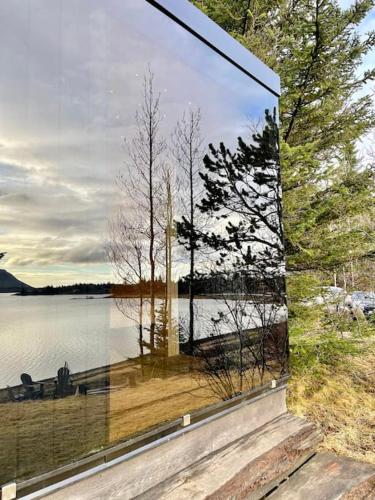 a large glass window with a view of a lake at Luxury Lakefront villa, infinity hot tub and sauna in Grímsnes og Grafningshreppur