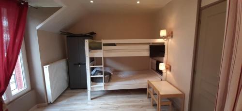 Postel nebo postele na pokoji v ubytování Appartement au cœur du Mont-Dore