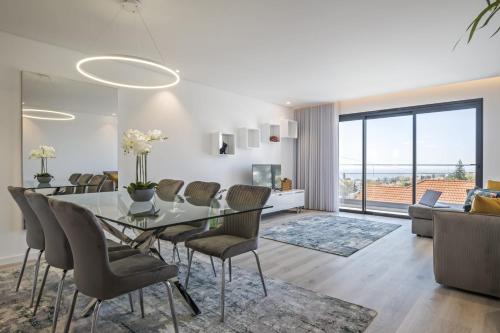 a dining room with a table and chairs at Contemporary Residence C by Homie in Funchal